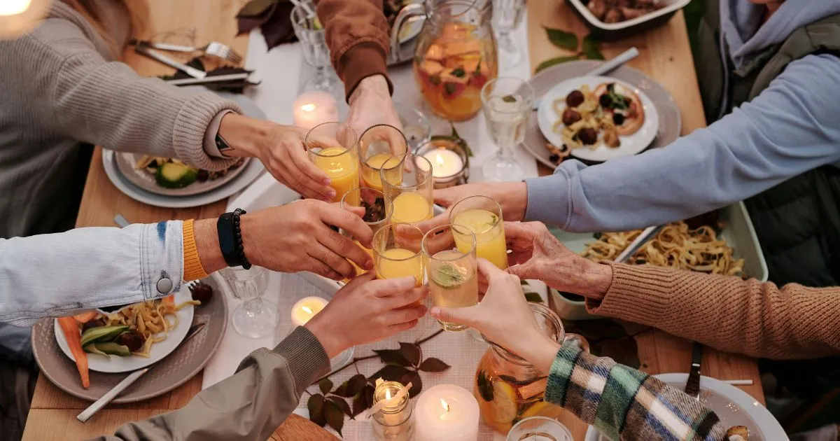 Photo by Askar repas Abayev from Pexels: https://www.pexels.com/photo/faceless-people-toasting-with-glasses-at-dinner-5638748/